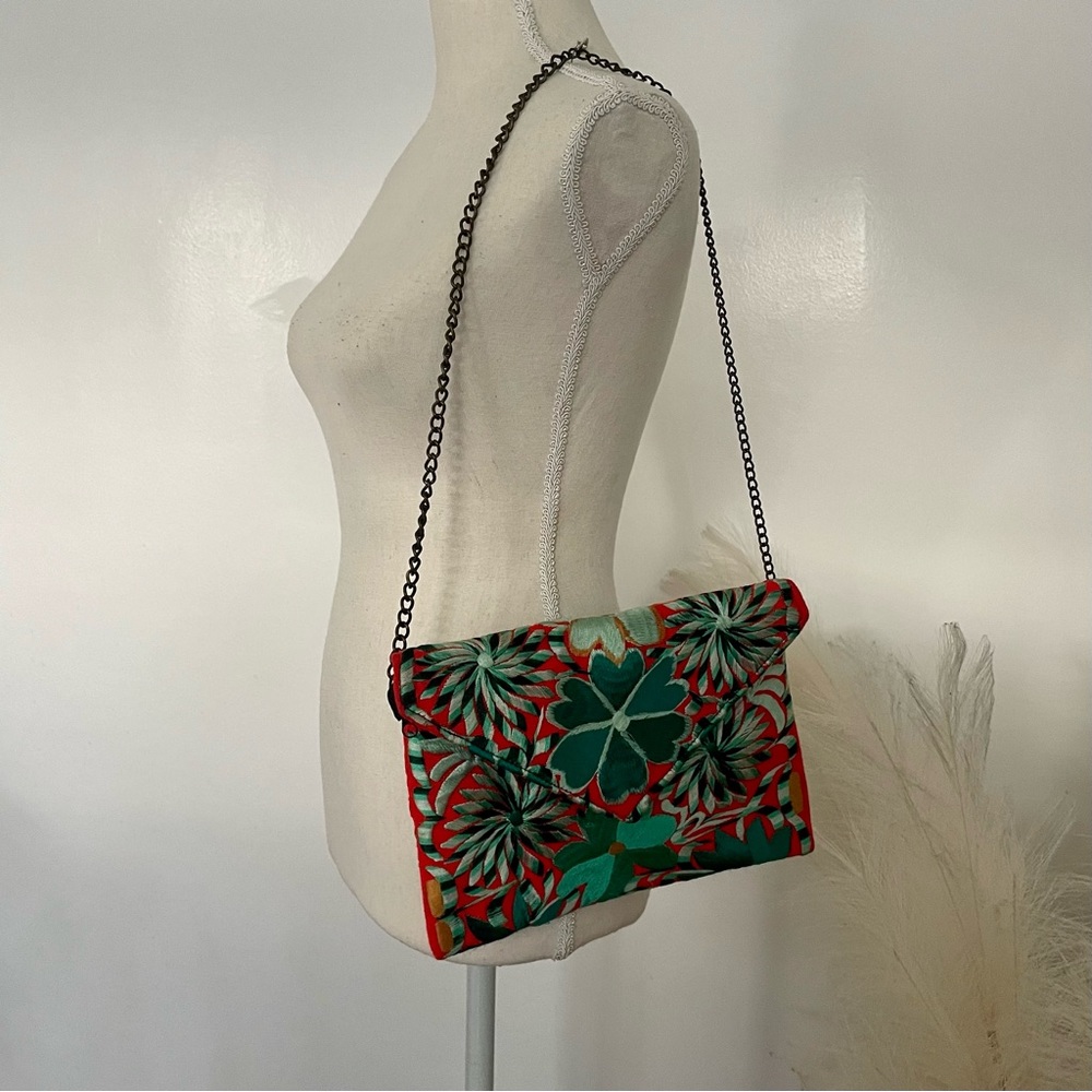 Teal and orange embroidered clutch